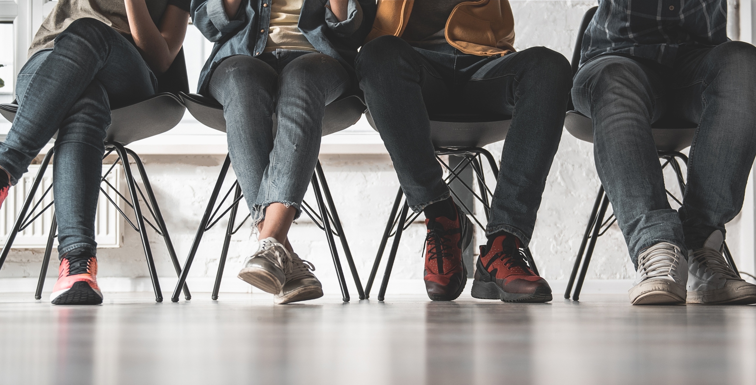 four pairs of seated legs