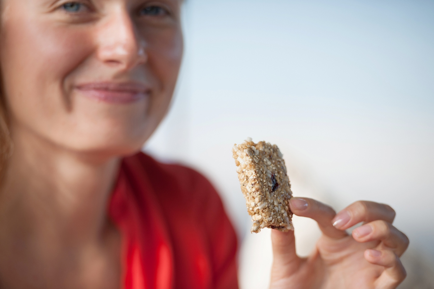 Woman eating a nutrition bar