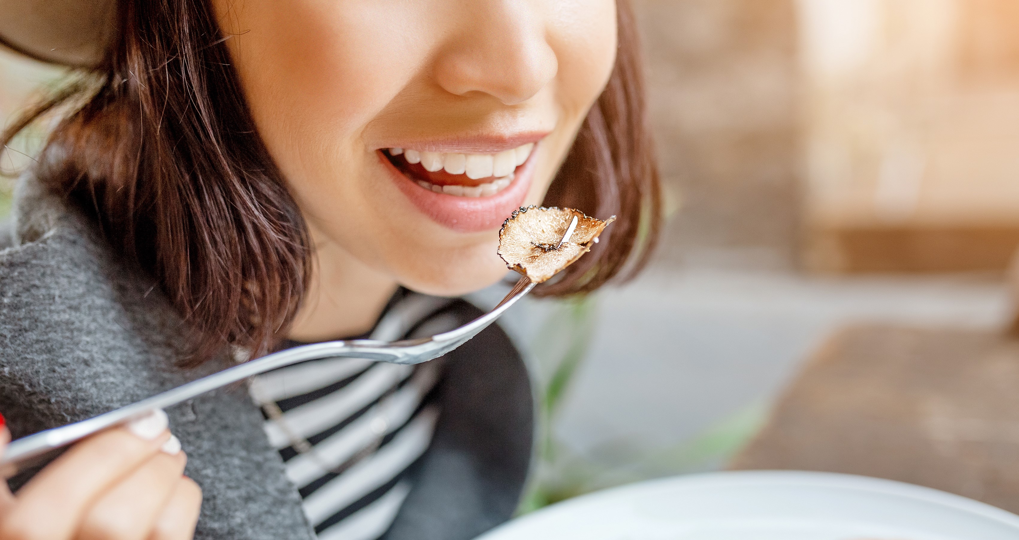 woman tasting food